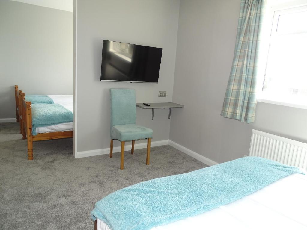 A television and/or entertainment center at Pen Mar Guest House 