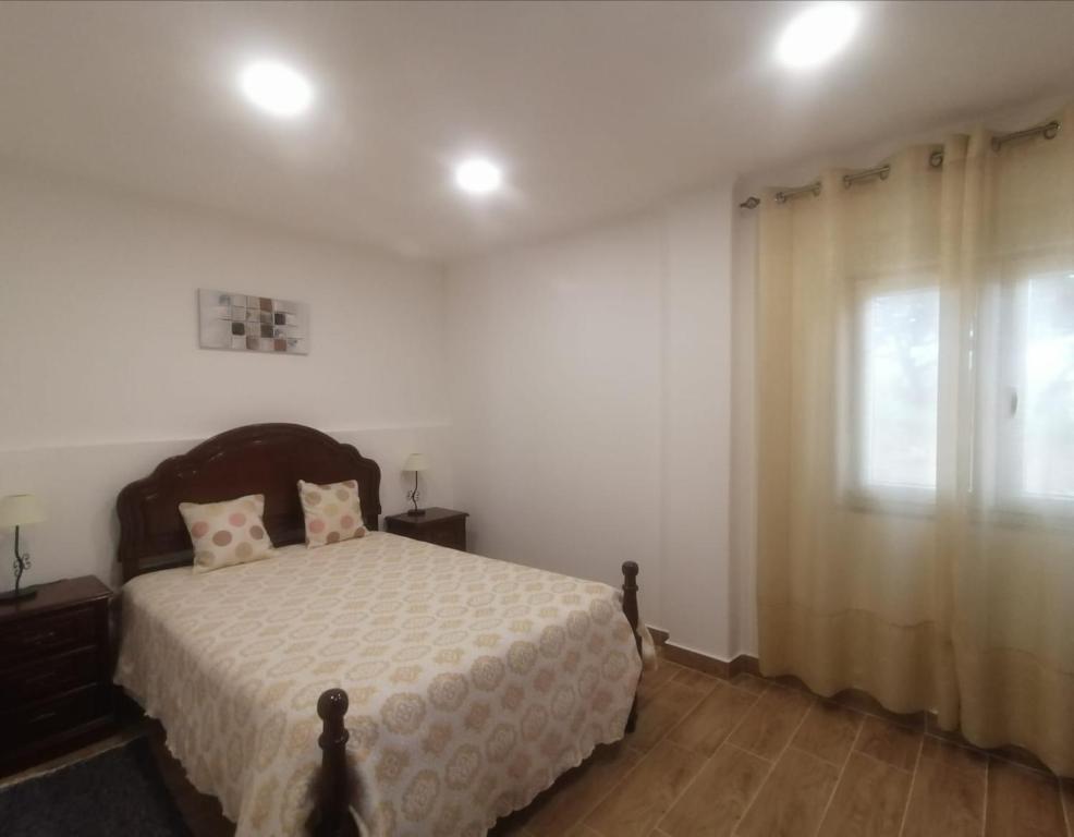 Postel nebo postele na pokoji v ubytování Monte da Vinha Nova
