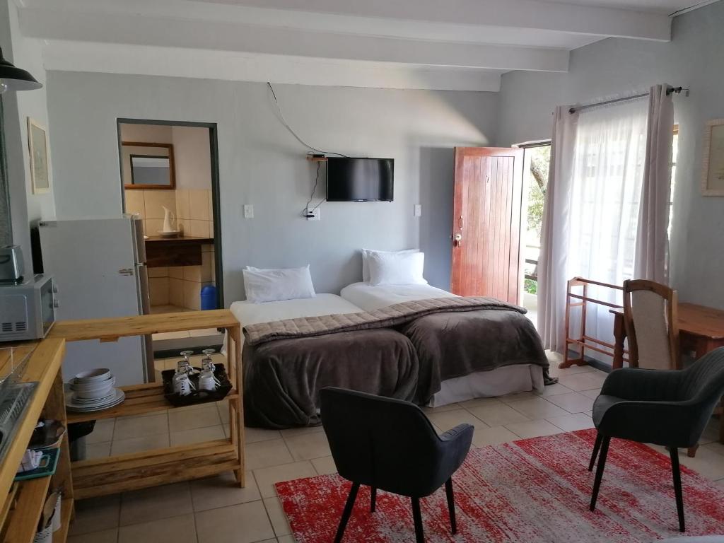 Katil atau katil-katil dalam bilik di Aanhuizen Guest House