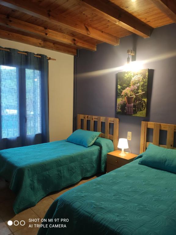 Postel nebo postele na pokoji v ubytování Apartamentos Goizeder