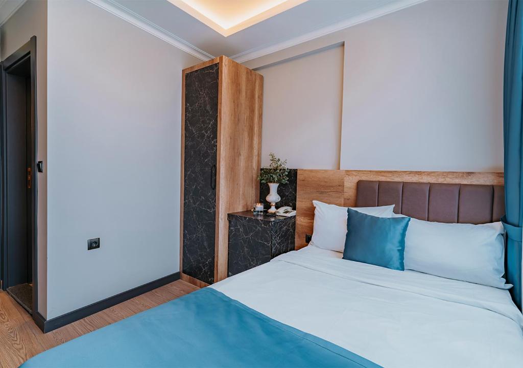 Postel nebo postele na pokoji v ubytování City Port Hotel Trabzon