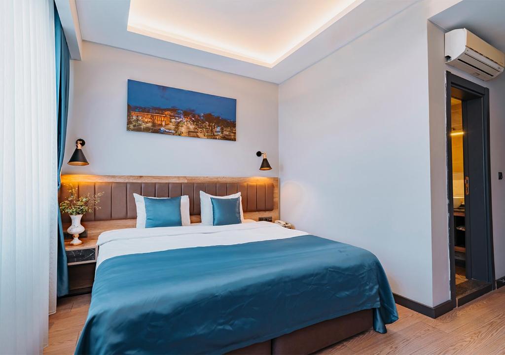 Postel nebo postele na pokoji v ubytování City Port Hotel Trabzon