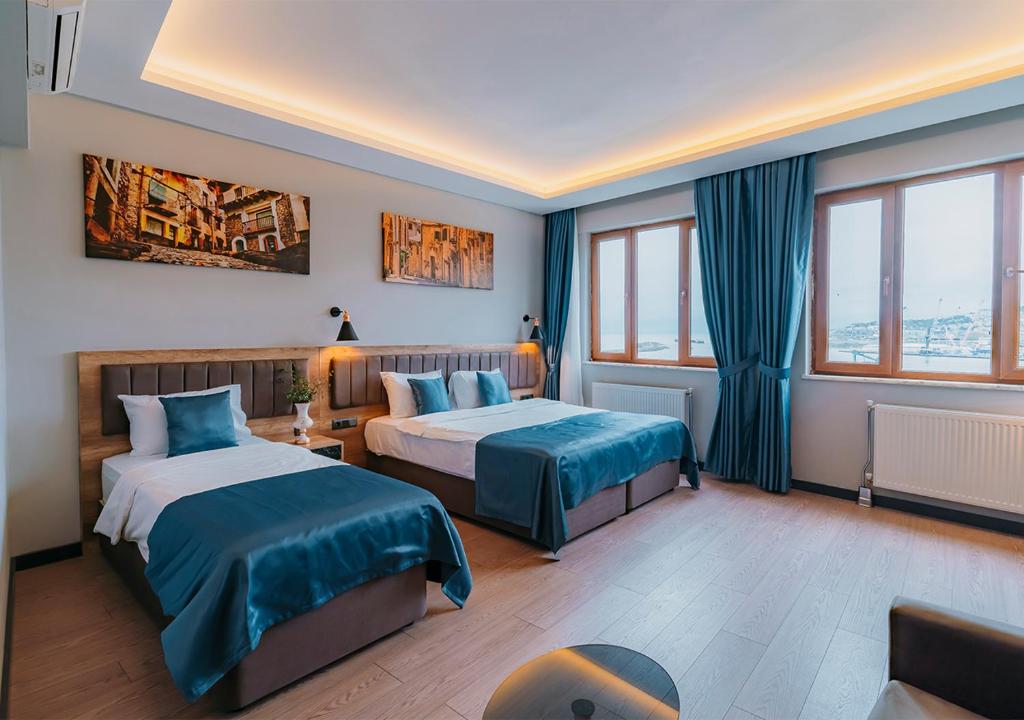 Postel nebo postele na pokoji v ubytování City Port Hotel Trabzon