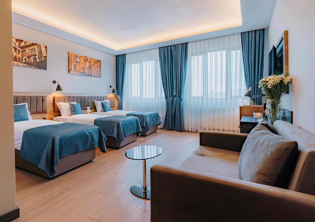 Postel nebo postele na pokoji v ubytování City Port Hotel Trabzon