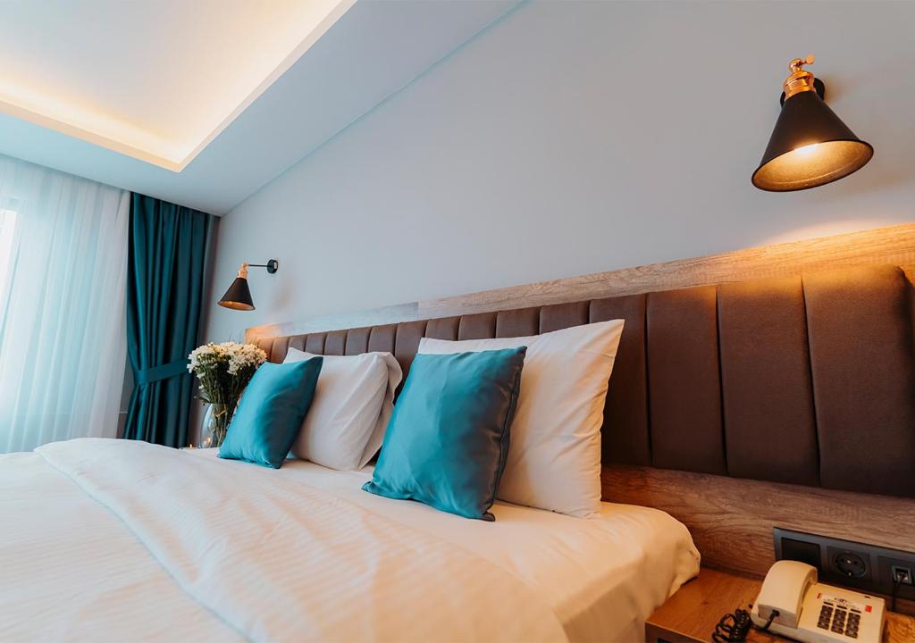 Postel nebo postele na pokoji v ubytování City Port Hotel Trabzon