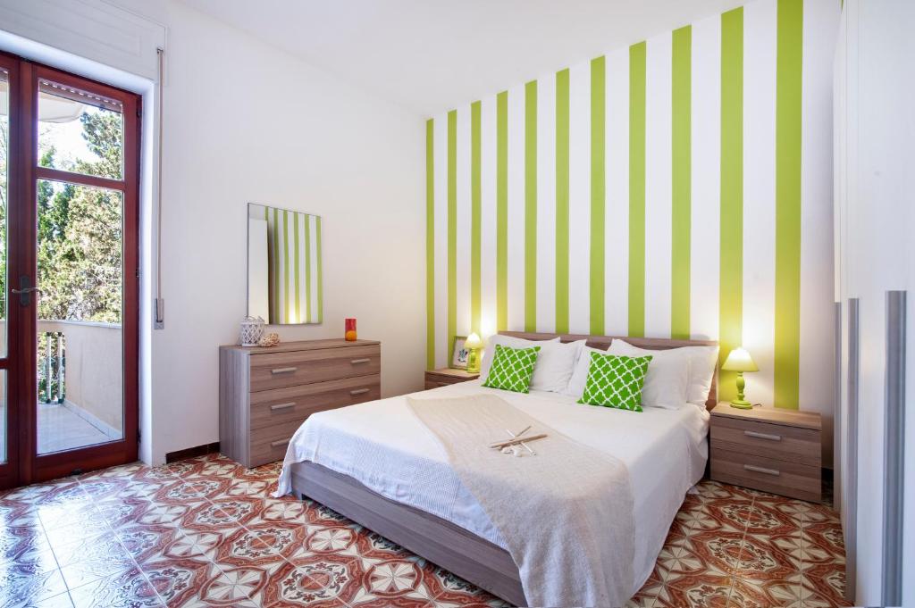 A bed or beds in a room at Baia Verde Beach & Fun Gallipoli - Lecce Selection