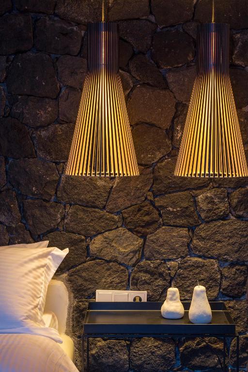 Postel nebo postele na pokoji v ubytování Aroma Suites
