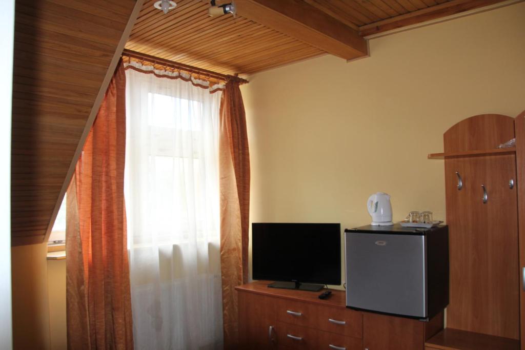 Kuchyňa alebo kuchynka v ubytovaní Pensjonacik ELMI