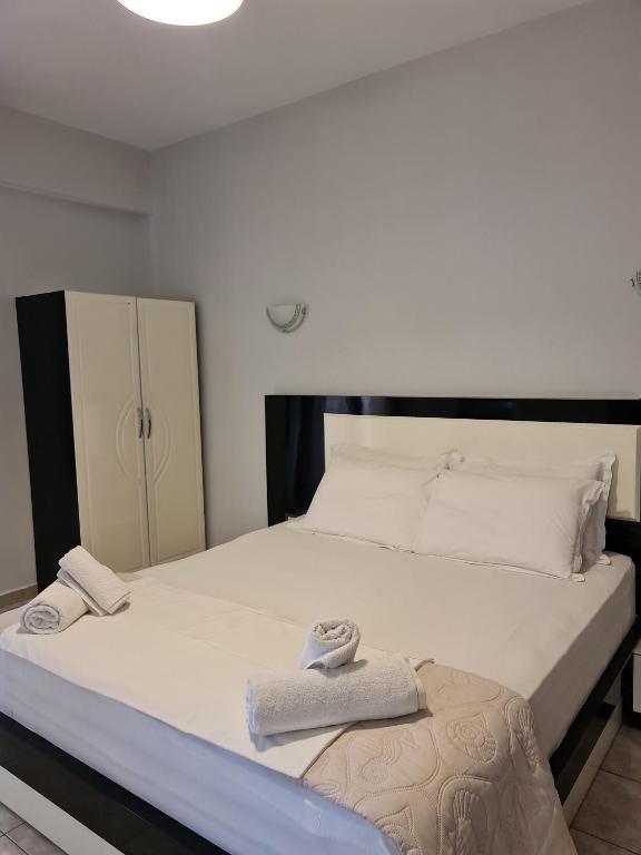Postel nebo postele na pokoji v ubytování Hotel Ardiani