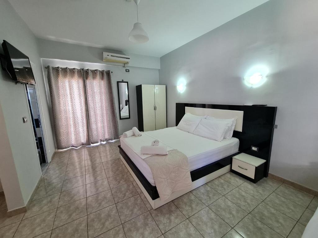 Postel nebo postele na pokoji v ubytování Hotel Ardiani