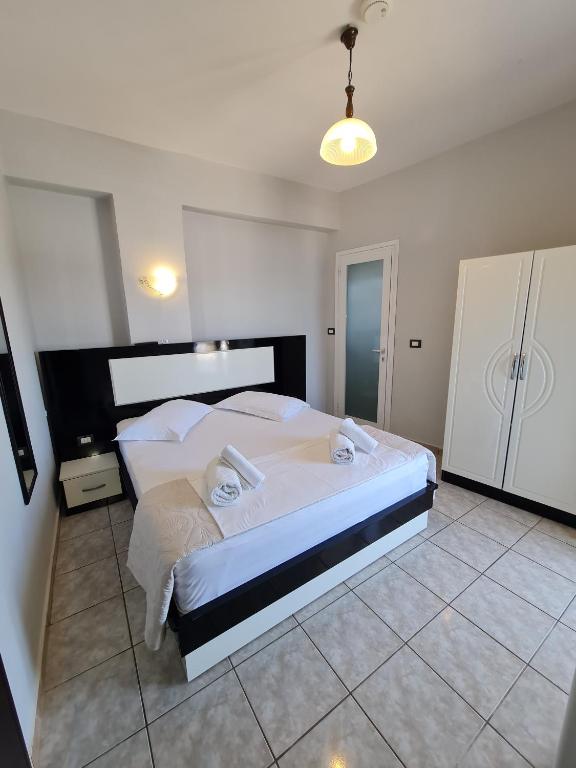 Postel nebo postele na pokoji v ubytování Hotel Ardiani
