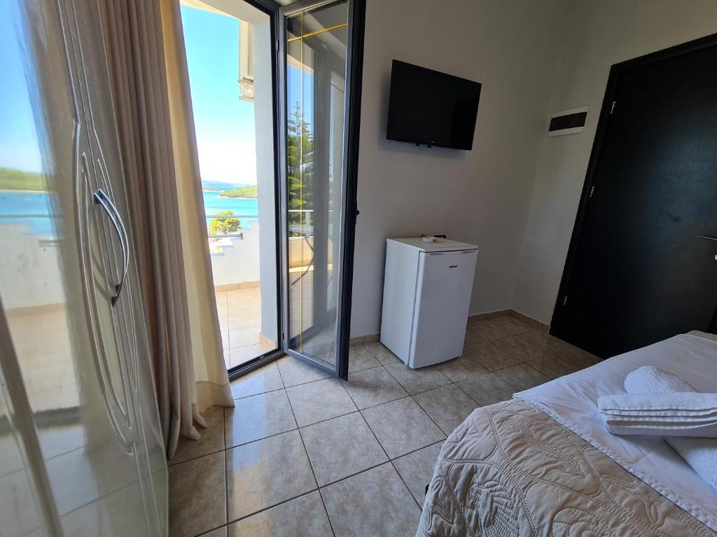 Postel nebo postele na pokoji v ubytování Hotel Ardiani