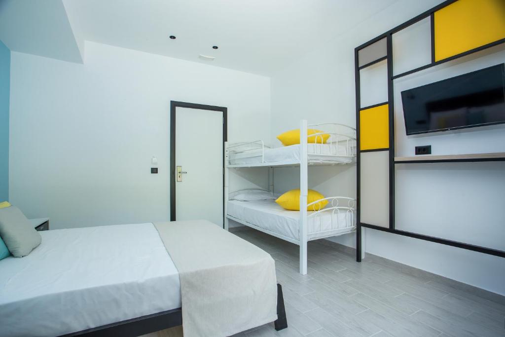 Postel nebo postele na pokoji v ubytování Faliraki Premium Hotel