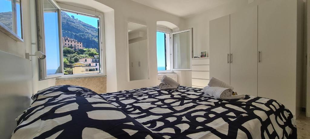 เตียงในห้องที่ House of Mitì - HOMY 5 TERRE RIOMAGGIORE