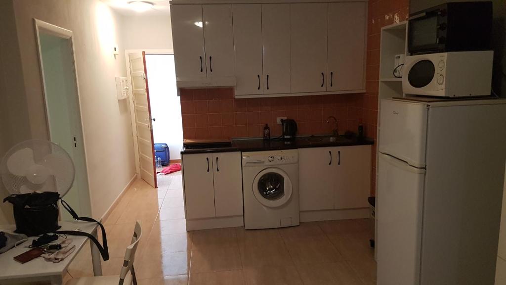 A kitchen or kitchenette at beach 400mtr, top of mountain with spectacular surround view 200mtr