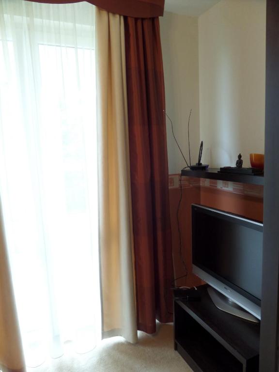 TV a/nebo společenská místnost v ubytování Nia Családi Apartman