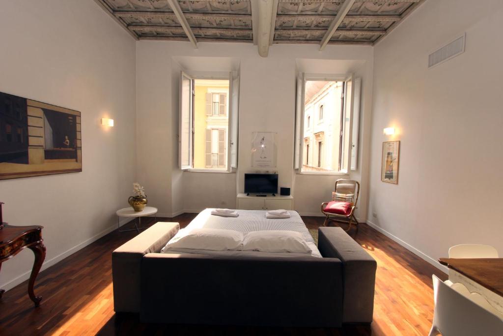 a bedroom with a large bed in a room at Ottoboni Flats in Rome