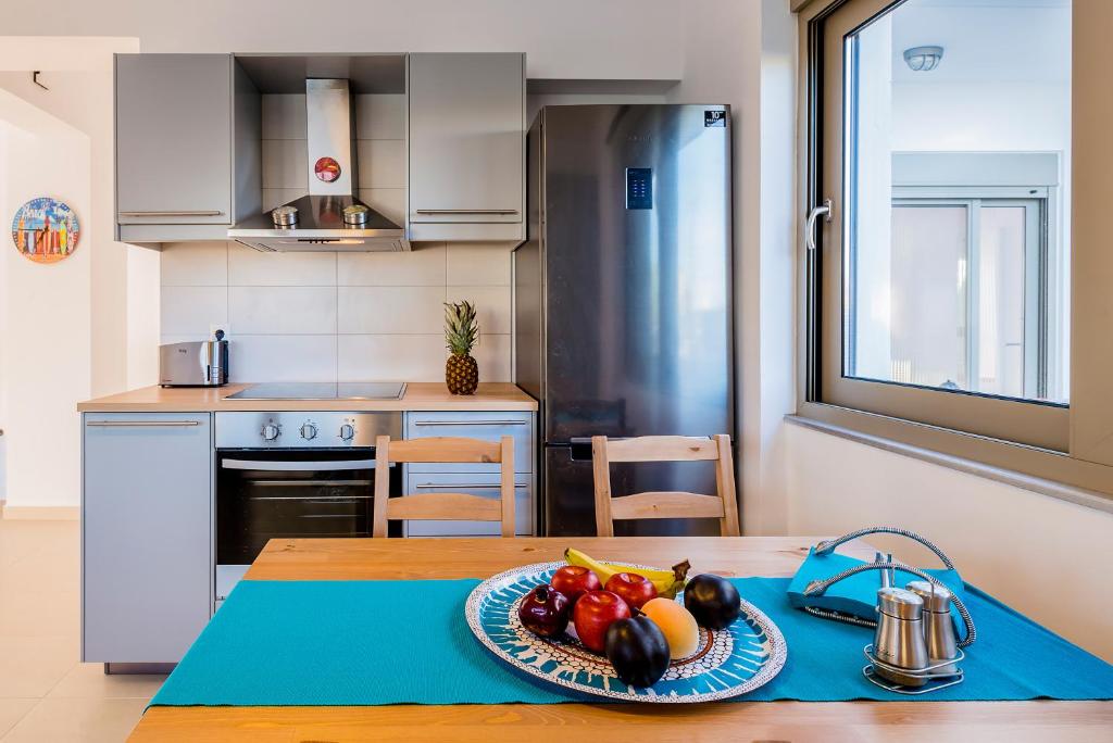 Kuchyň nebo kuchyňský kout v ubytování Filoxenia Villas