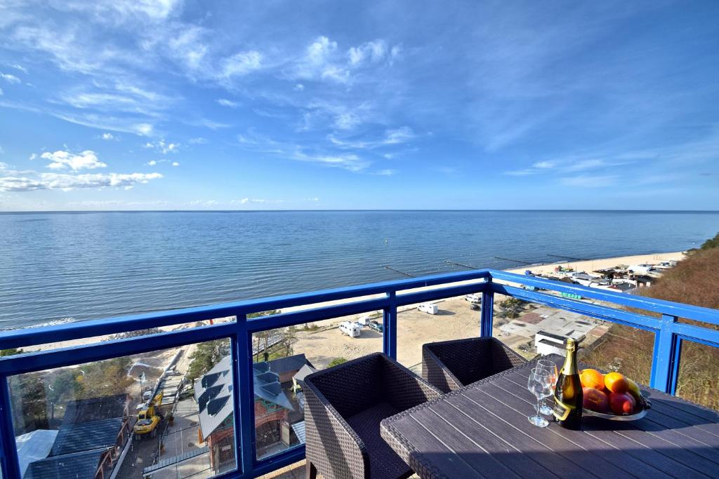 a view of the ocean from the balcony of a condo at Apartament Perłowy SeaView by Rent like home in Międzyzdroje