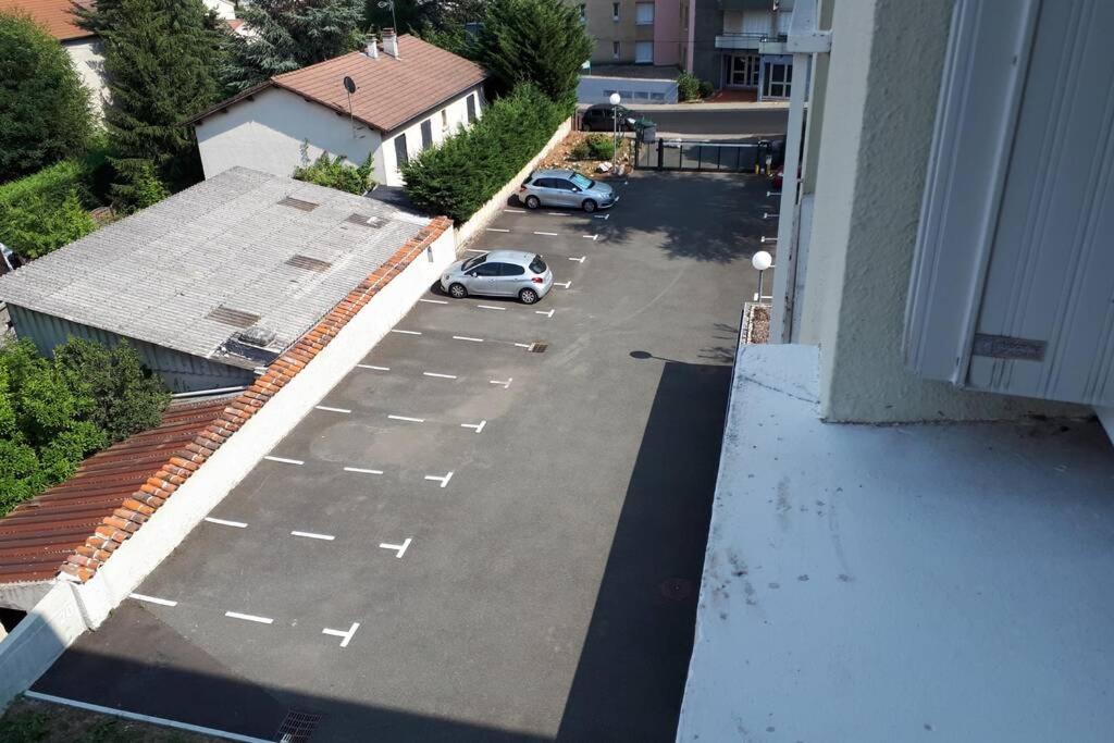 an aerial view of a parking lot with a car at Saint-Etienne Appart&#39;hôtel de Bellevue in Saint-Étienne