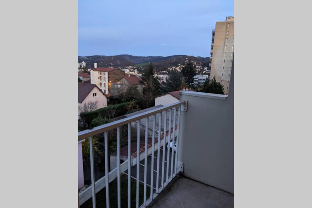 a balcony with a white fence and a building at Saint-Etienne Appart&#39;hôtel de Bellevue in Saint-Étienne