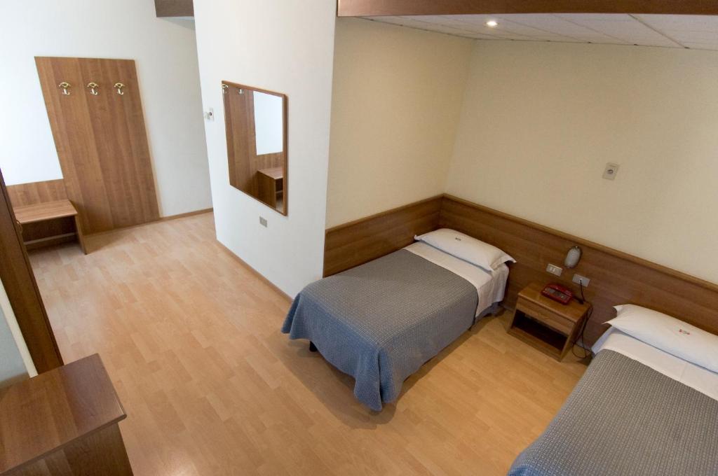 Postel nebo postele na pokoji v ubytování Hotel Europa