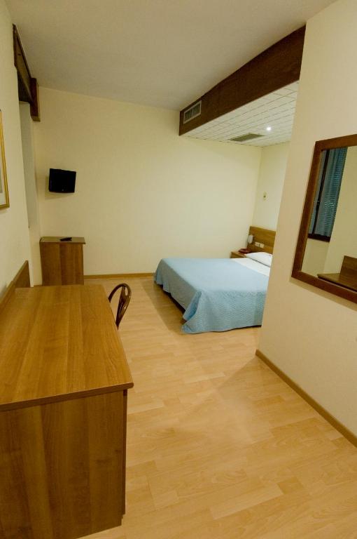 Postel nebo postele na pokoji v ubytování Hotel Europa