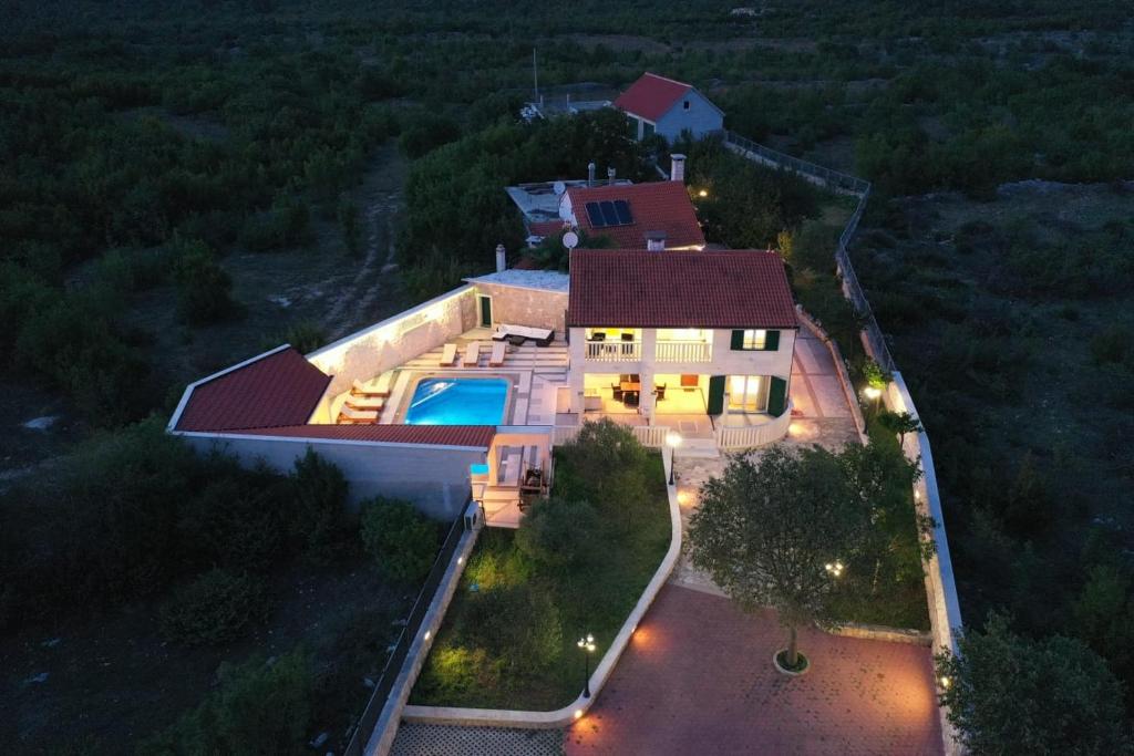 an overhead view of a house with a swimming pool at Villa AnBer in KoruÅ¡ce