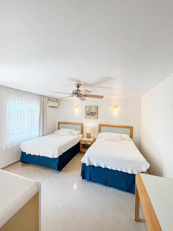 Cama o camas de una habitación en Hotel Cocoplum Beach