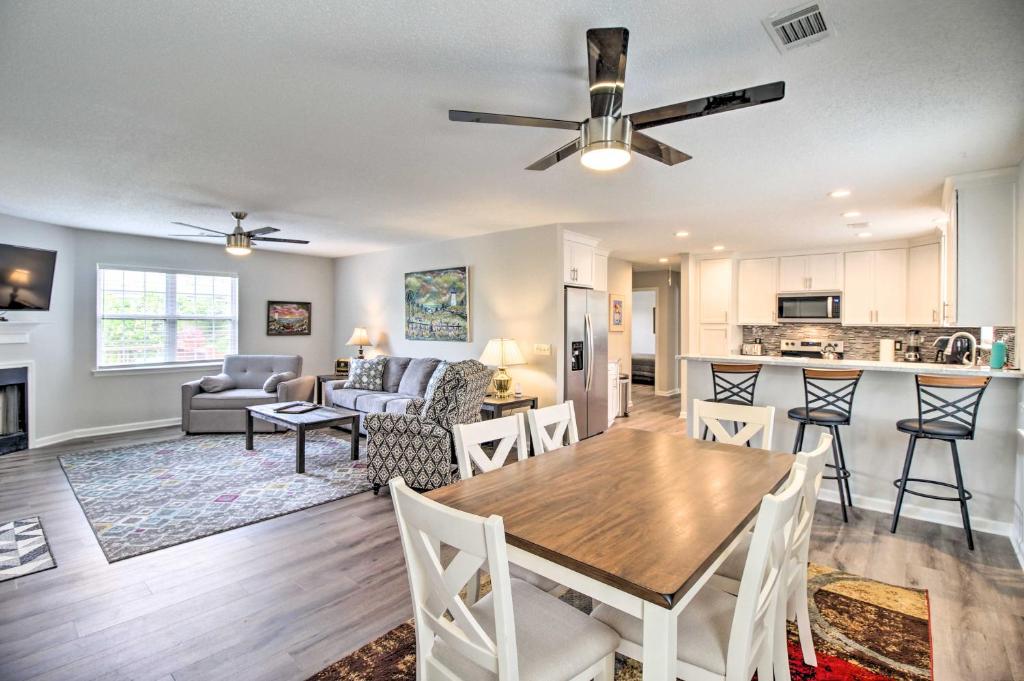 a kitchen and living room with a table and chairs at Ideally Located Luxe Beach House on Tybee Island in Tybee Island