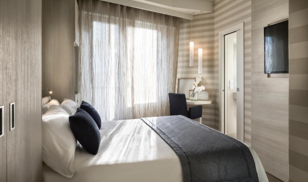Postel nebo postele na pokoji v ubytování Hotel Nautico