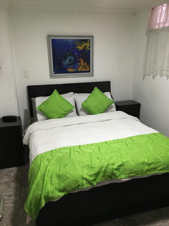 Postel nebo postele na pokoji v ubytování Hotel Fénix Real Bogotá