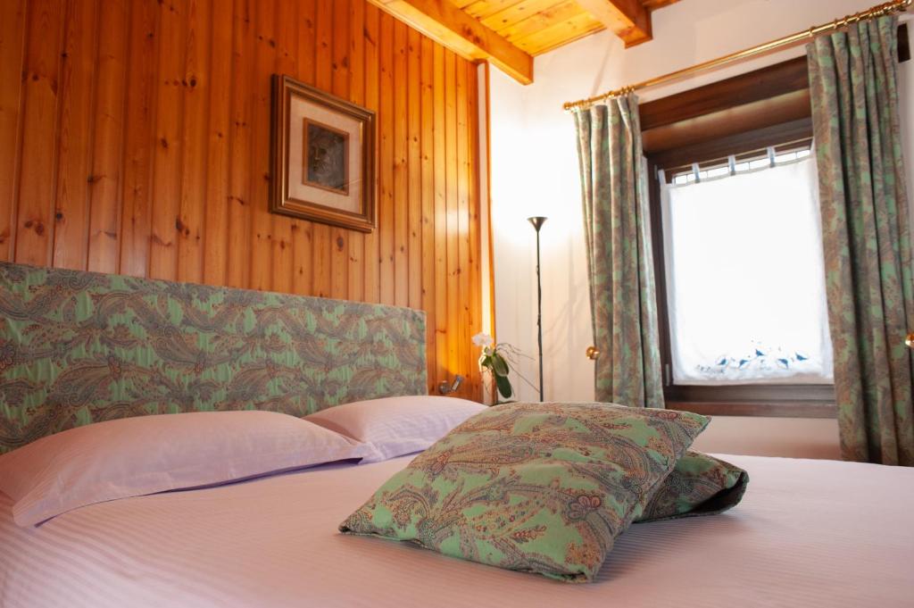 En eller flere senge i et værelse på Casa Vacanza Scacco d' Argento
