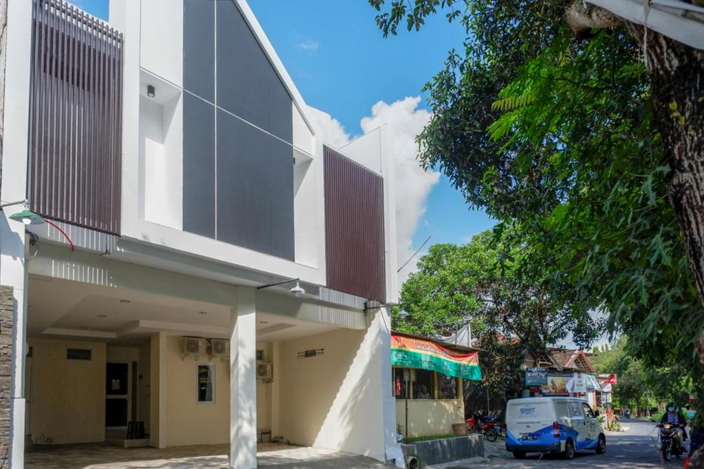a building on the side of a street at RedDoorz near Ambarrukmo Plaza Mall in Yogyakarta