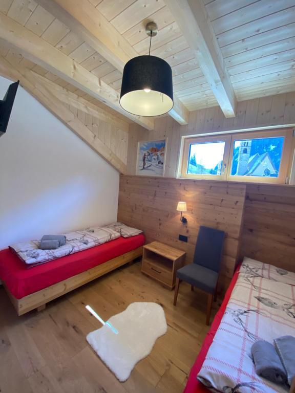 A bed or beds in a room at Cèsa Prinoth