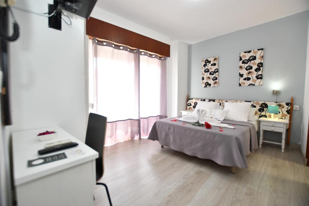 Cama o camas de una habitación en HB Torrevieja