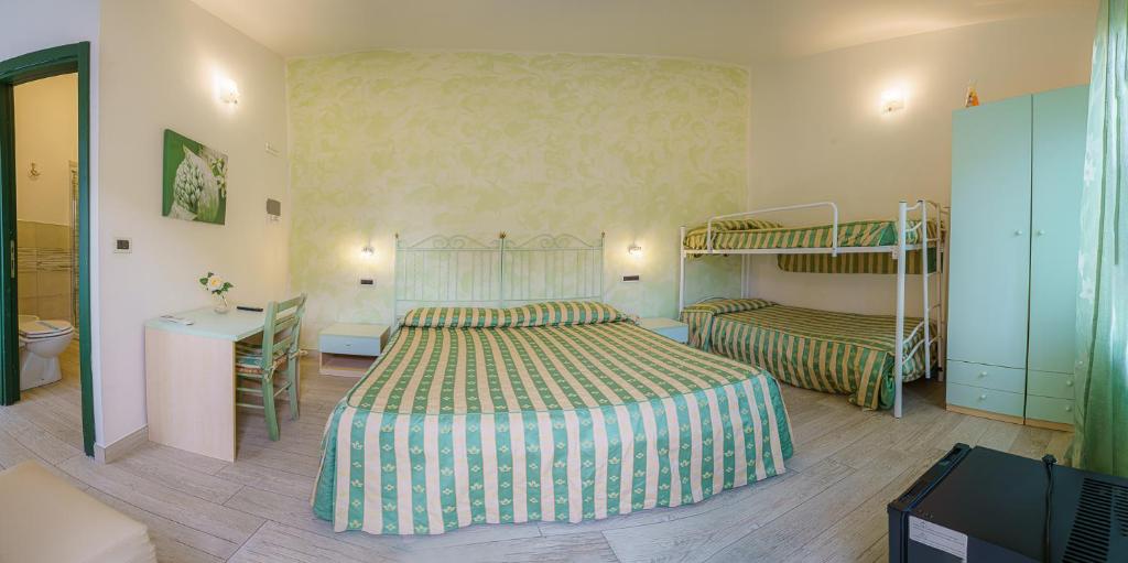 Posteľ alebo postele v izbe v ubytovaní Albergo La Lampara