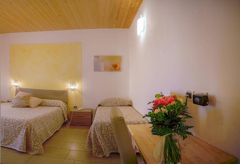 Posteľ alebo postele v izbe v ubytovaní Albergo La Lampara
