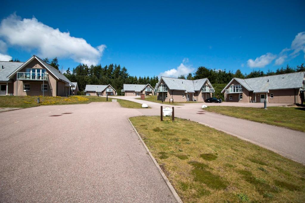 a road in front of a house with houses at Inchmarlo Golf Resort, Banchory Villa 26 AS 00266F in Banchory