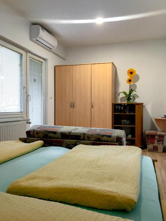 Postel nebo postele na pokoji v ubytování Apartments Sončnica