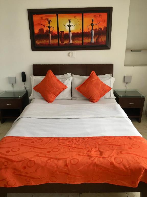 Postel nebo postele na pokoji v ubytování Hotel Fénix Real Bogotá