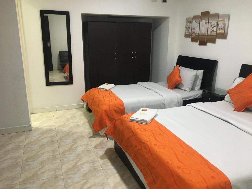 Postel nebo postele na pokoji v ubytování Hotel Fénix Real Bogotá