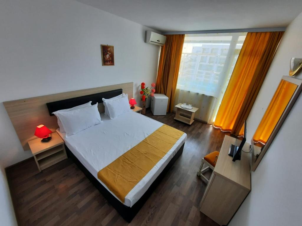Postel nebo postele na pokoji v ubytování Hotel Apollo