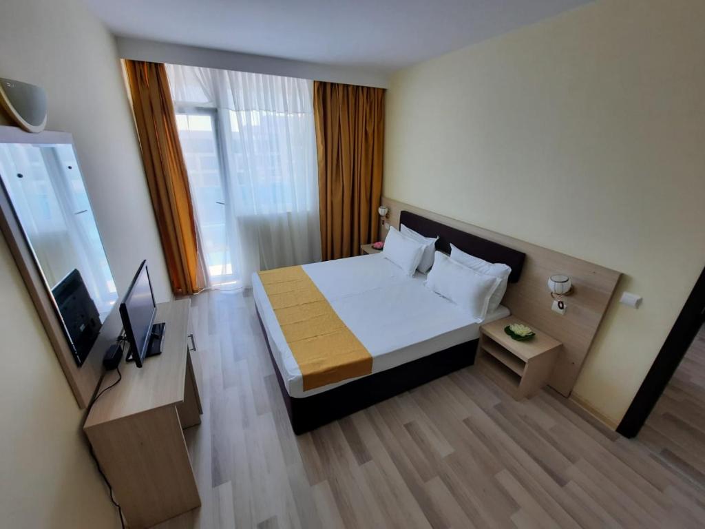 Postel nebo postele na pokoji v ubytování Hotel Apollo