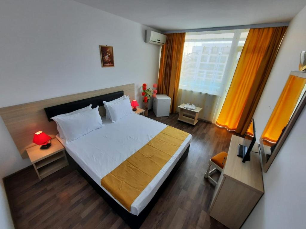 Postel nebo postele na pokoji v ubytování Hotel Apollo