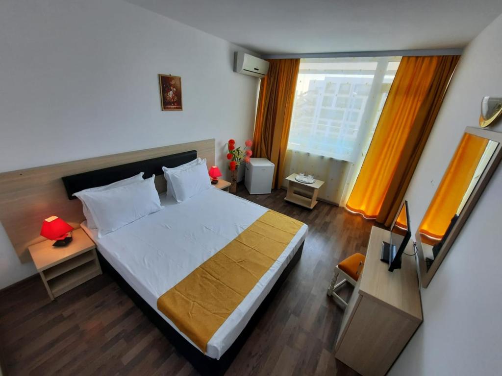 Postel nebo postele na pokoji v ubytování Hotel Apollo