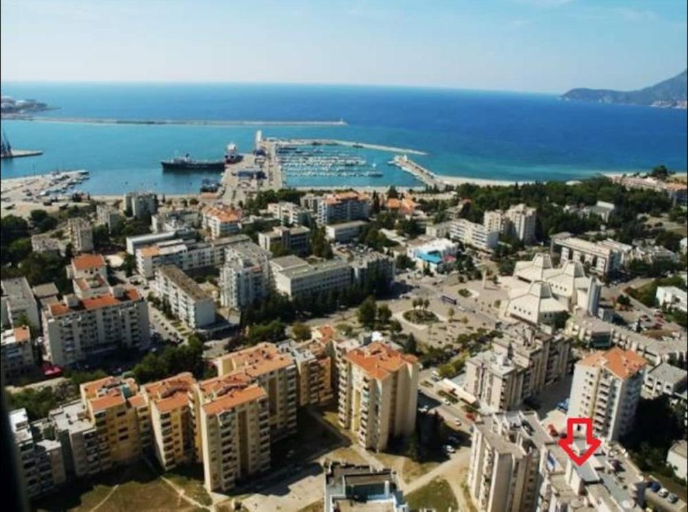 an aerial view of a city with buildings and the ocean at Room in apartment with a host in the center of Bar in Bar