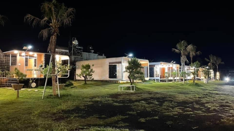 a park in front of a building at night at Homestay Papa garden in Pleiku