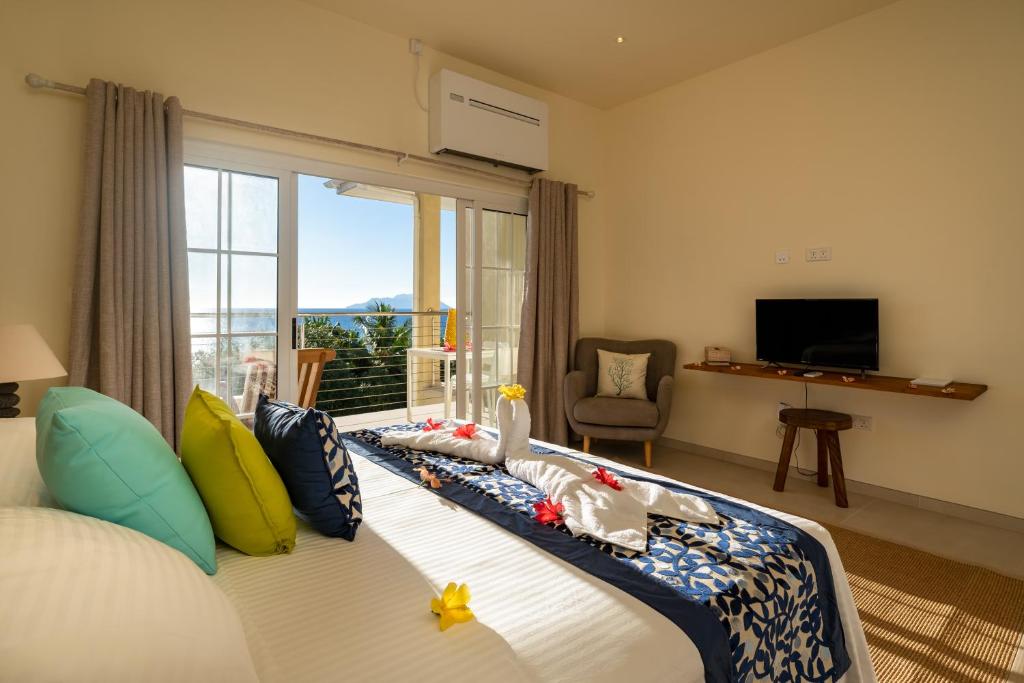 TV a/nebo společenská místnost v ubytování Villa Panoramic Seaview