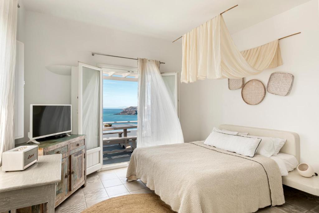TV a/nebo společenská místnost v ubytování Grand View - Megalochori Santorini